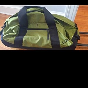 LL Bean Black Adventure Rolling Duffle Bag.
